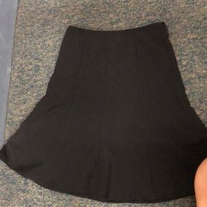 A black, knee high skirt